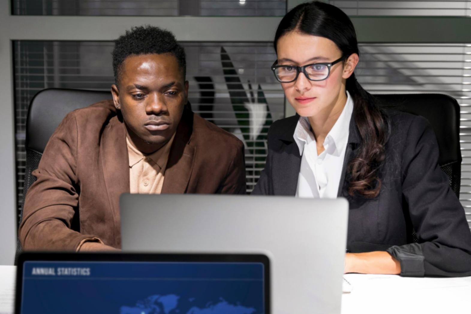 Person reviewing financial documents and planning materials